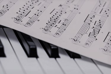 Piano keys with sheet music